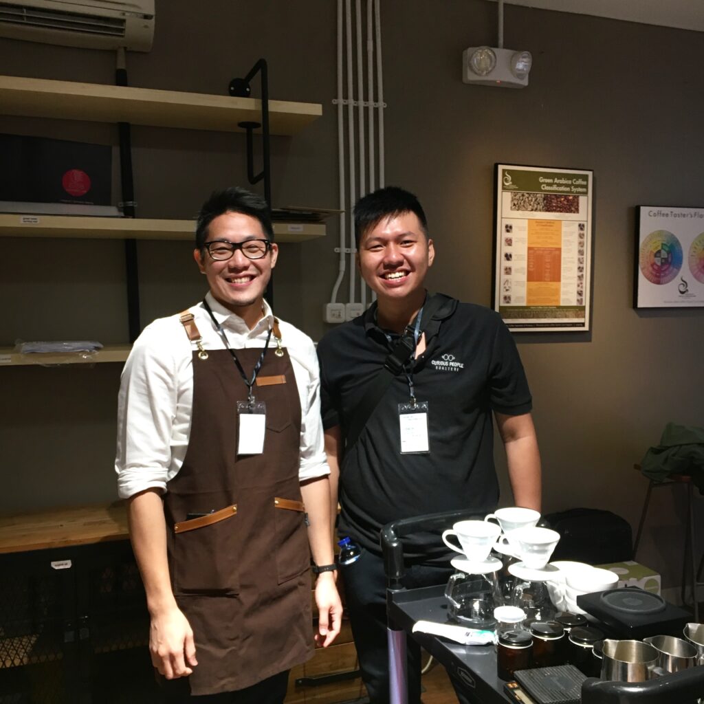 Two competitors in a barista championship.