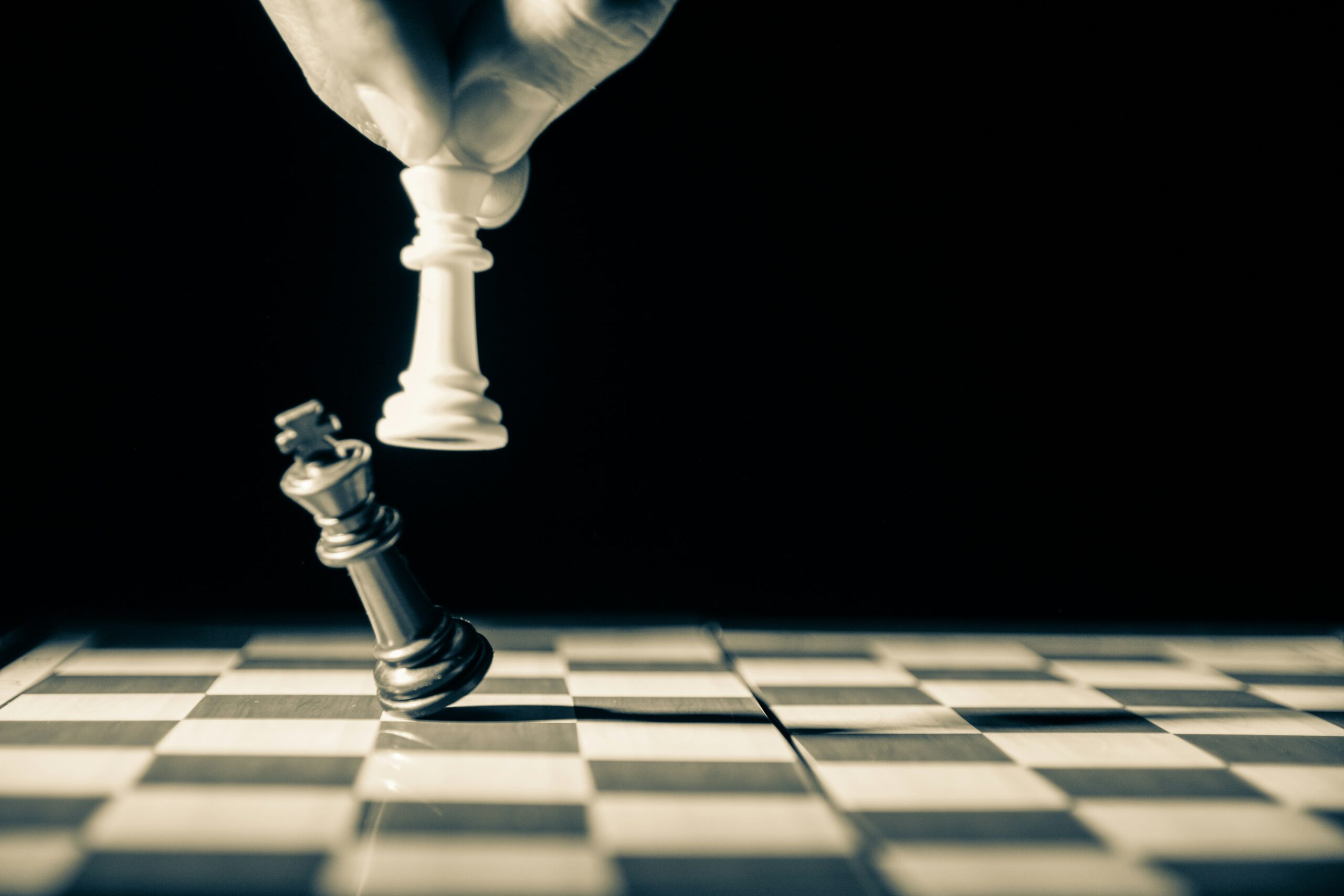 White queen knocks king chessboard.